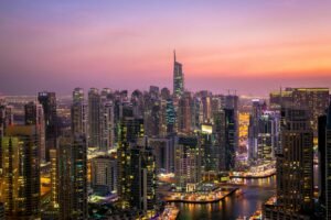 Skyline of Dubai with foreign investors exploring real estate opportunities amid currency changes