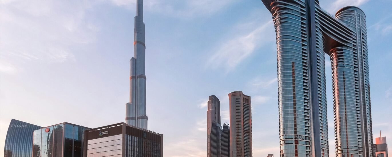 Emaar VYOM digital platform interface with Dubai skyline in the background
