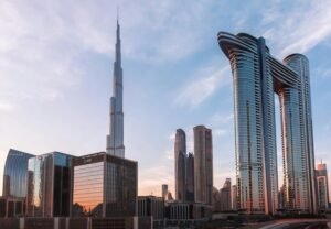 Emaar VYOM digital platform interface with Dubai skyline in the background