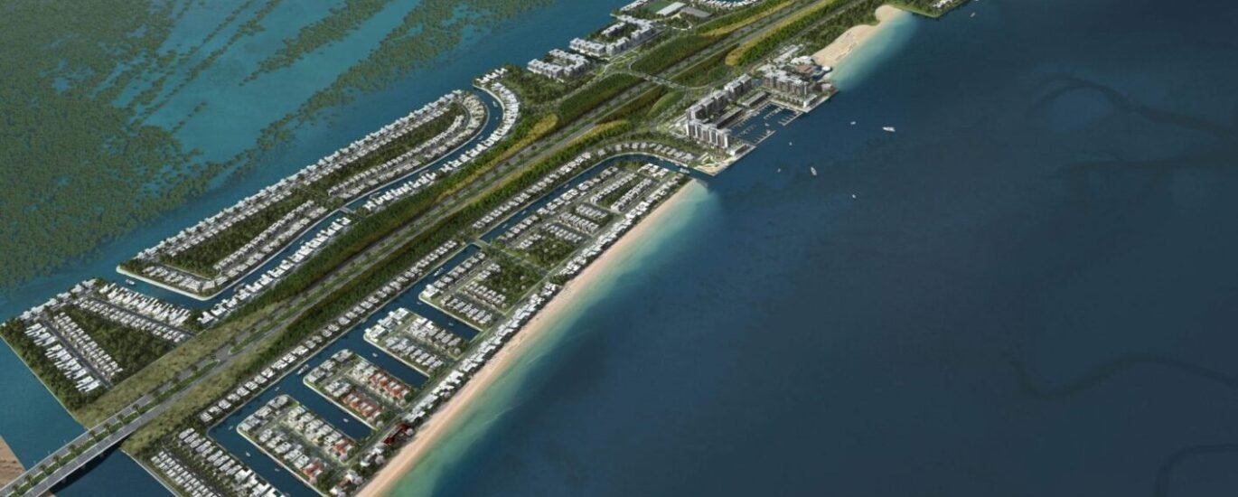 Fahid Island beachfront residences by Aldar in Abu Dhabi with blue water and modern buildings