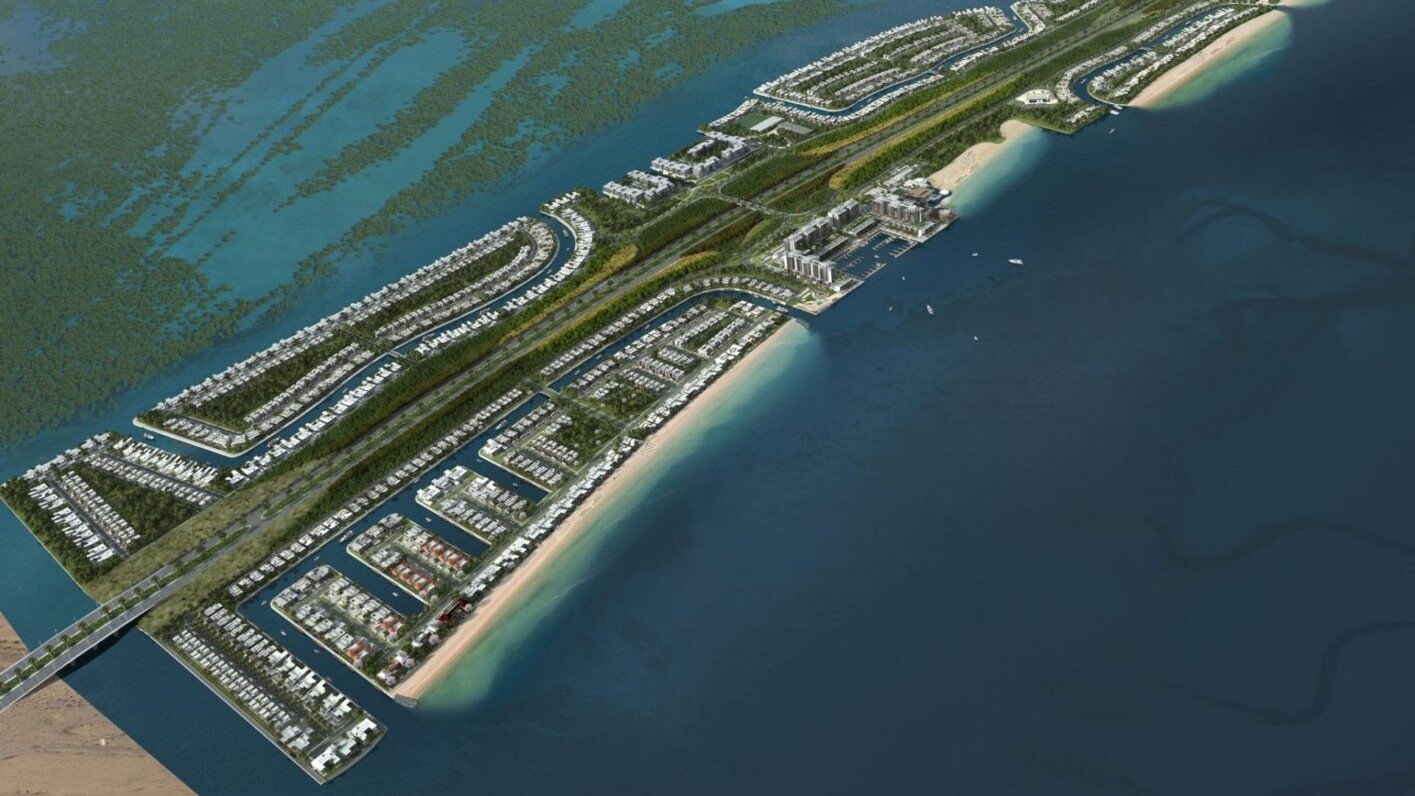 Fahid Island beachfront residences by Aldar in Abu Dhabi with blue water and modern buildings