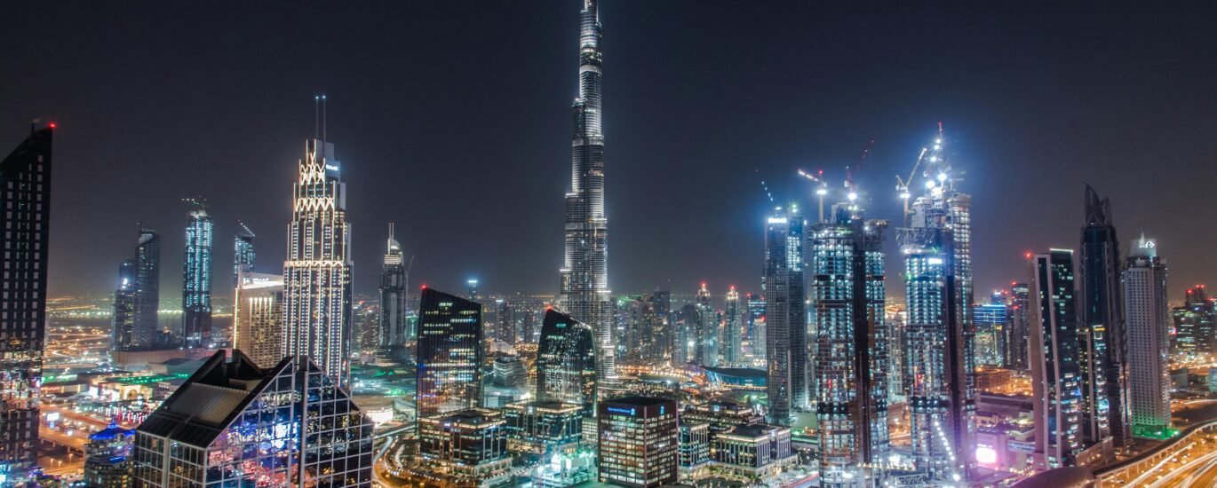 Dubai skyline showing luxury high-rises and waterfront developments at sunset