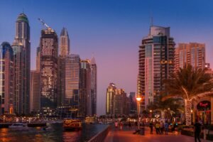 High-net-worth individuals arriving in Dubai with luxury skyline and wealth symbols