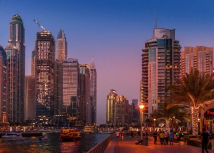 High-net-worth individuals arriving in Dubai with luxury skyline and wealth symbols