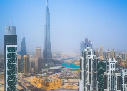 Aerial view of Dubai Marina and villa communities showing contrast in housing styles